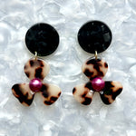 Acrylic Flower Drop Earrings in black, purple, and beige