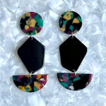 Acrylic Pendulum Drop Earrings in Masquerade Belle, black, red, yellow, and green 