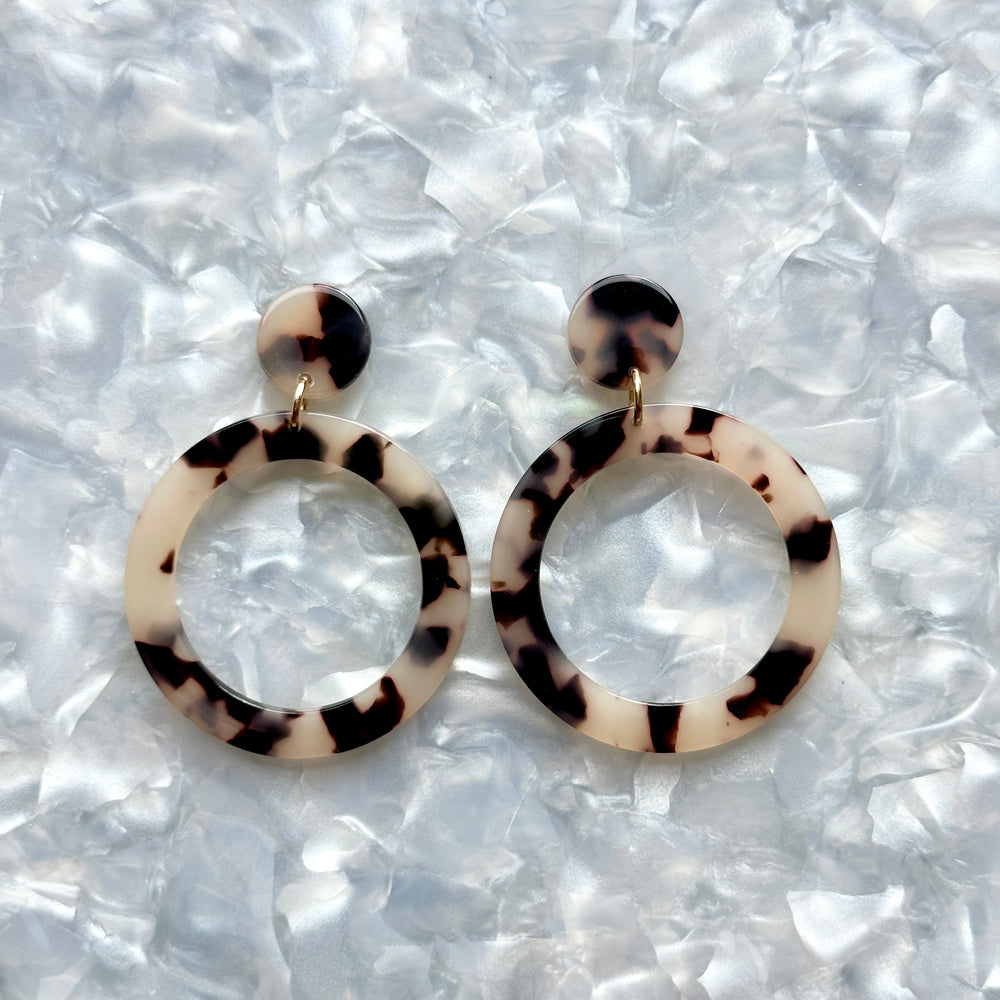 Acrylic open circle drop earrings in black and white tortoise