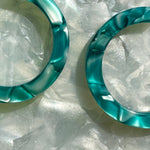 Women wearing Acrylic Hoop Earrings in blue 