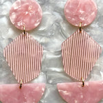 woman wearing Acrylic Pendulum Drop Earrings in Day Drift Away and Pink 