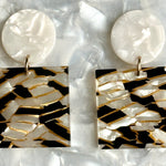 woman wearing Acrylic Square Drop Earrings in Black and White Crackle