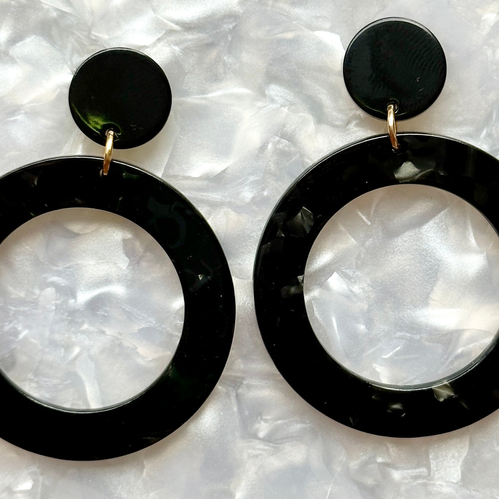 Woman wearing Acrylic open circle drop earrings in black 