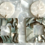 woman wearing Small Acrylic Square Drop Earrings in Abalone, blue and gray 