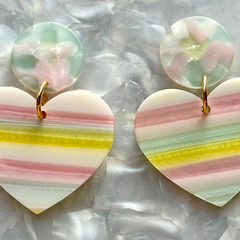 woman wearing  acrylic Heart Earrings in Talk Sweet To Me, pink, green, yellow and light blue 