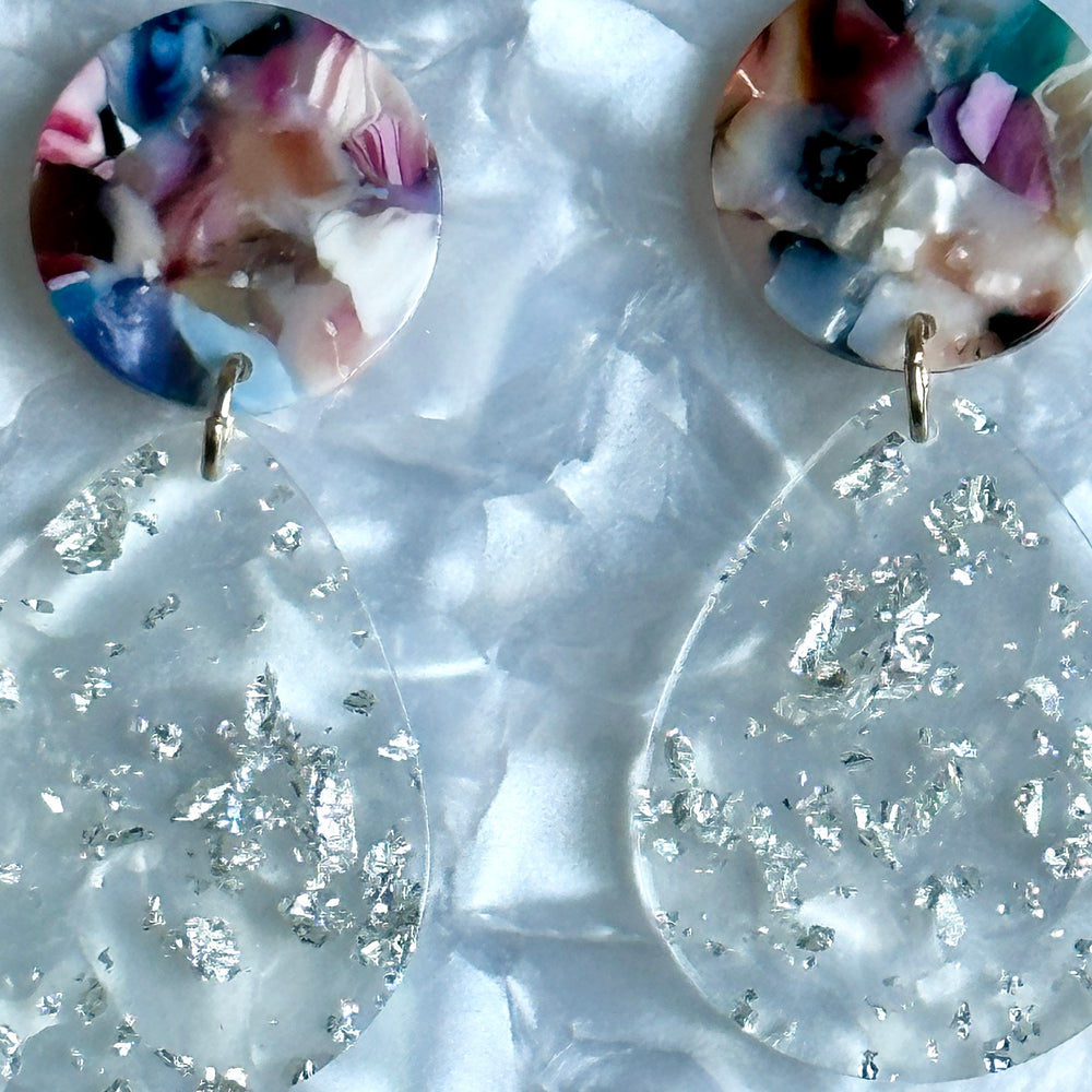 close up of Acrylic Teardrop Earrings in Stars Aligned, clear and light multicolor