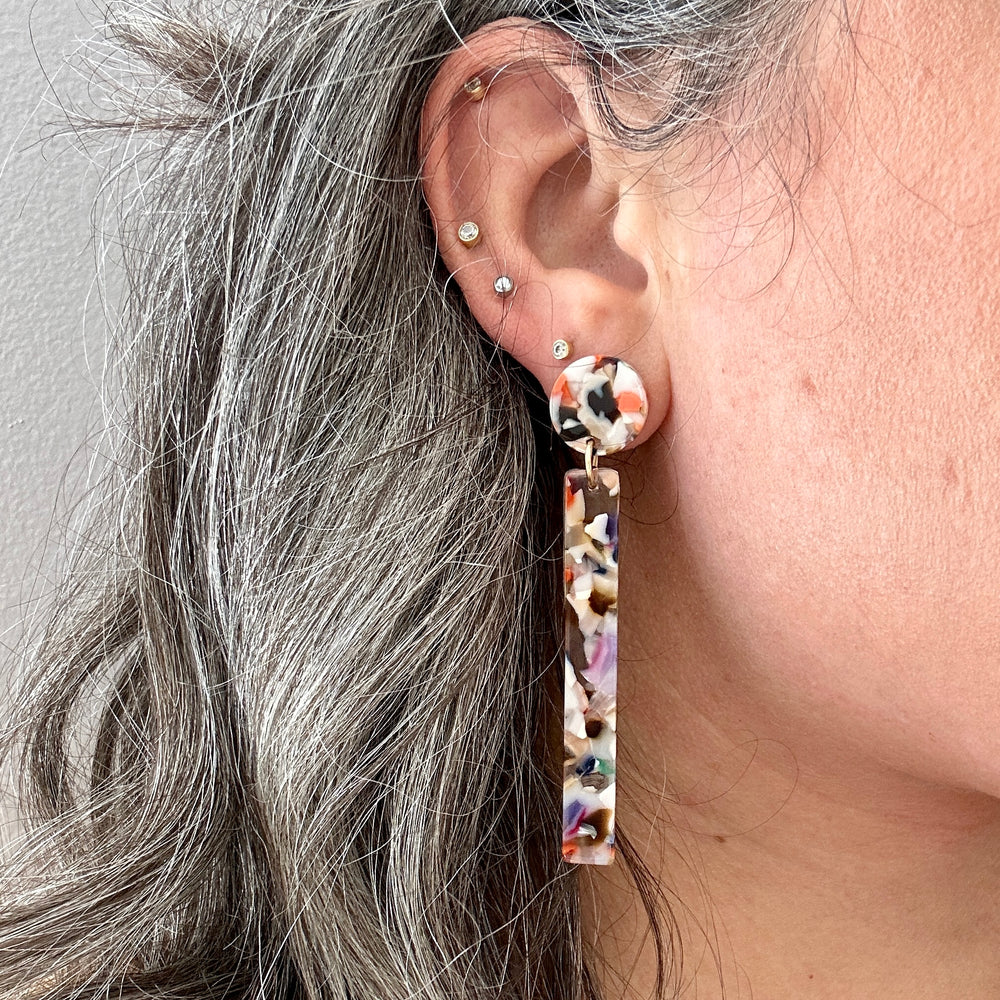 Woman wearing acrylic Matchstick Drop Earrings in Light Multicolor