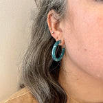 Women wearing Acrylic Hoop Earrings in blue 