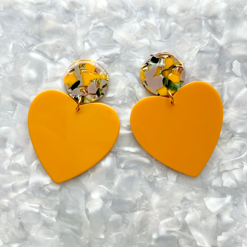 acrylic Heart Earrings in Pencil Me In, yellow, black, lilac, and green 