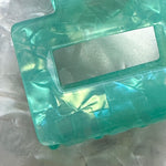 woman wearing acrylic claw clip in teal me you love me teal green