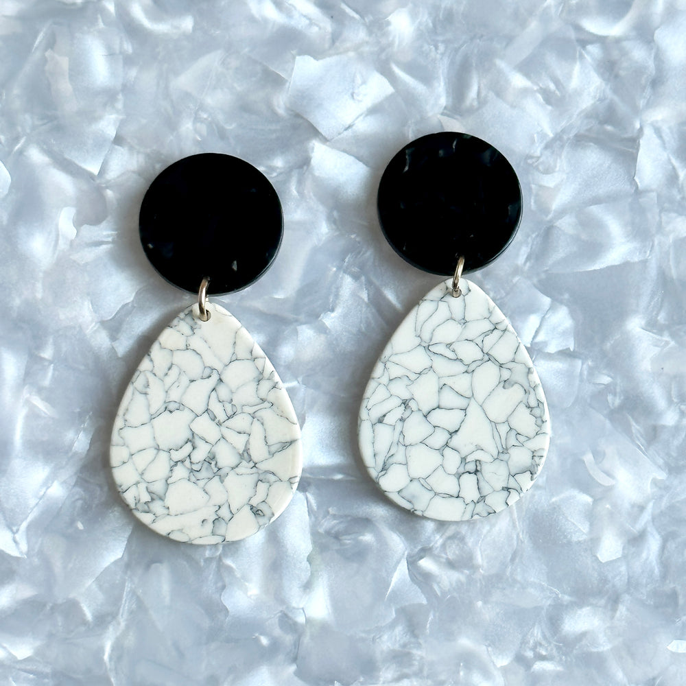  acrylic teardrop earrings in white, gray, and black 