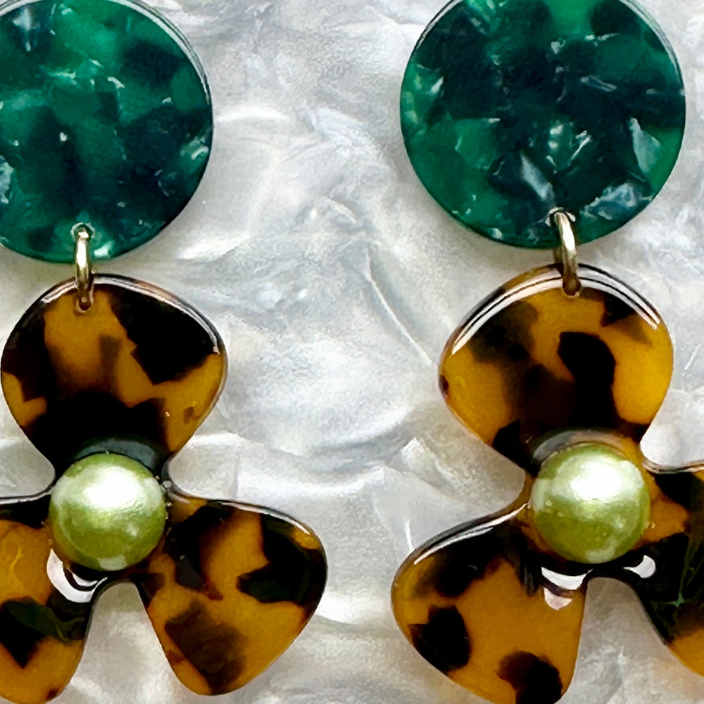 close up of Acrylic Flower Drop Earrings in Emerald green and tortoise