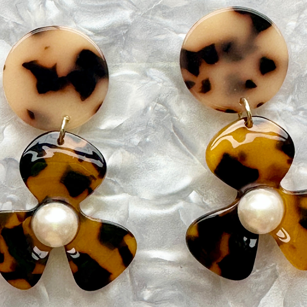 close up of Acrylic Flower Drop Earrings in Tortoise