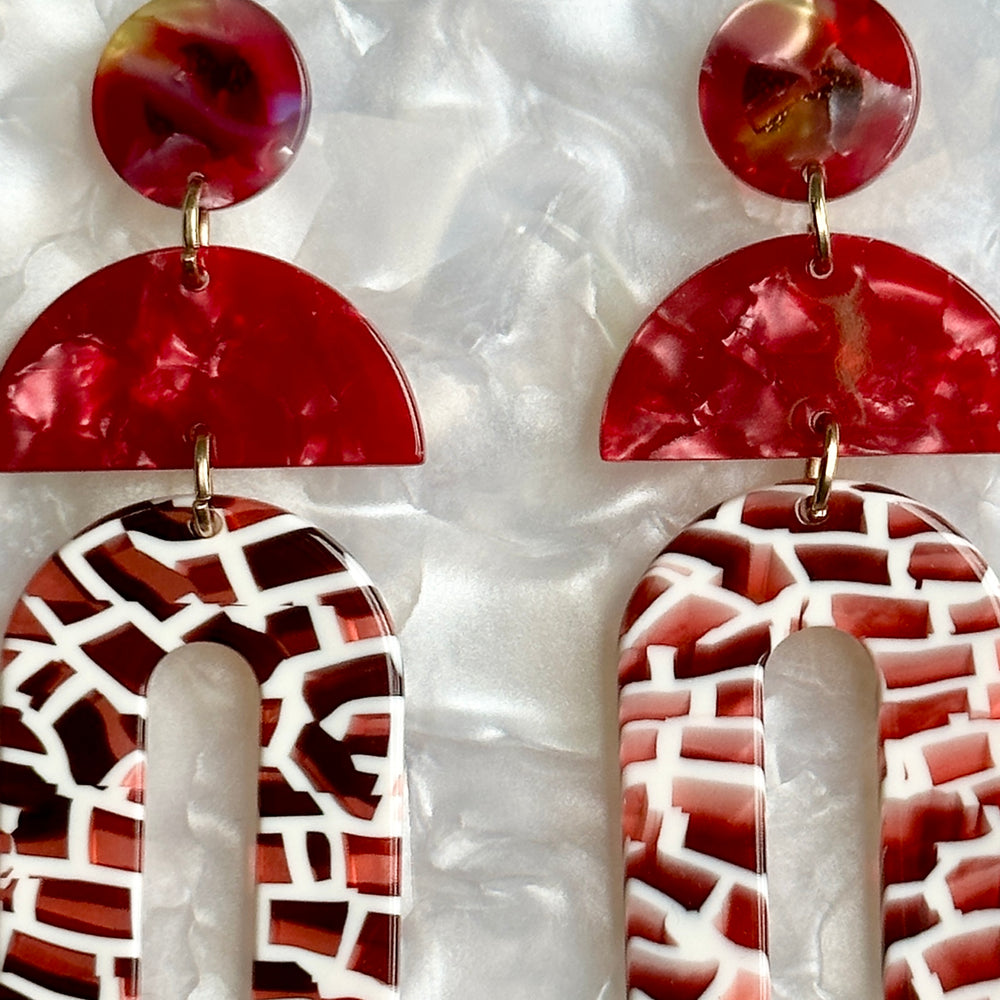 woman wearing Acrylic arch drop earring in red