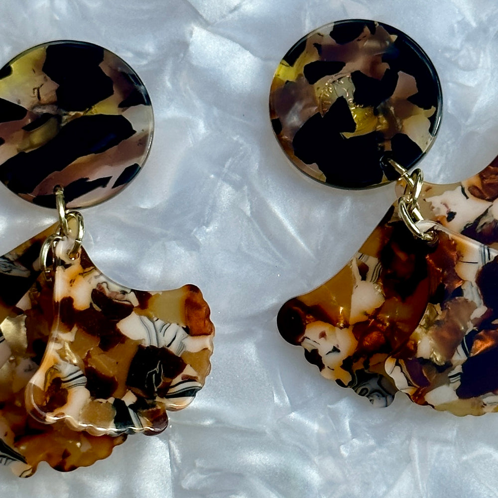 close up of Mini acrylic Petal Drop Earrings in Peanut Brittle brown