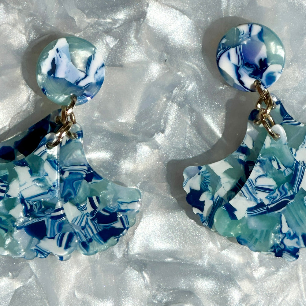 woman wearing Mini acrylic flower Petal Drop Earrings in blue