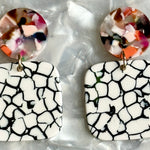 close up of Small Acrylic Square Drop Earrings in You Crackle Me Up, black, white and light multicolor