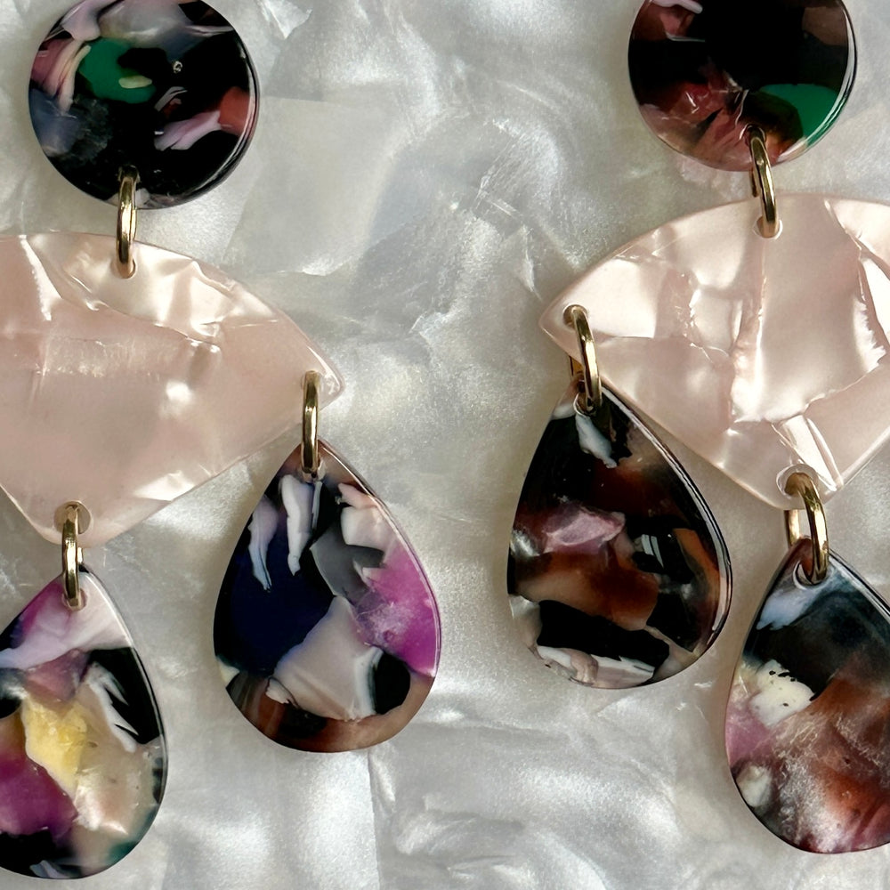 woman wearing acrylic Chandelier Drop Earrings in pink and multicolor