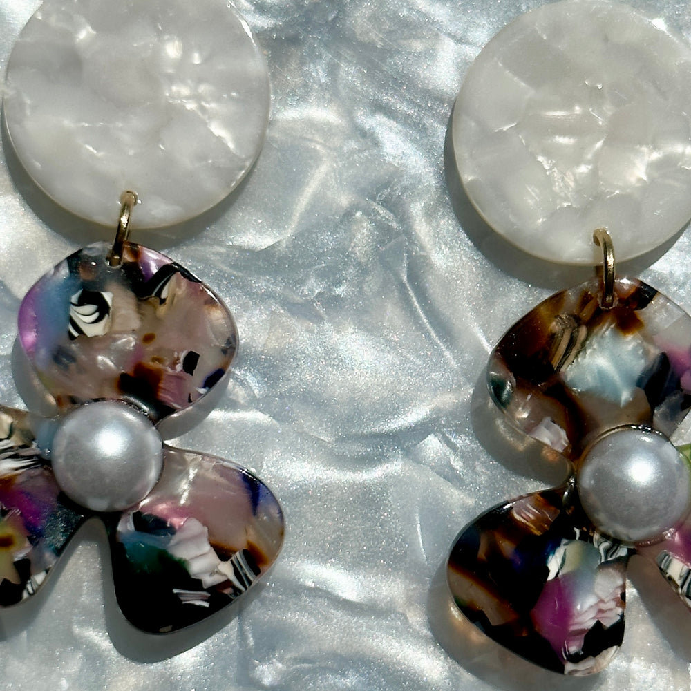 close up of acrylic Flower Drop Earrings in multicolor and white