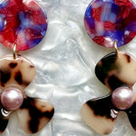 close up of acrylic Flower Drop Earrings in red, purple and blonde tortoise