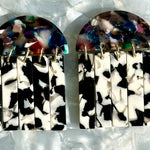 close up of acrylic Fringe Earrings in black, white and multicolor