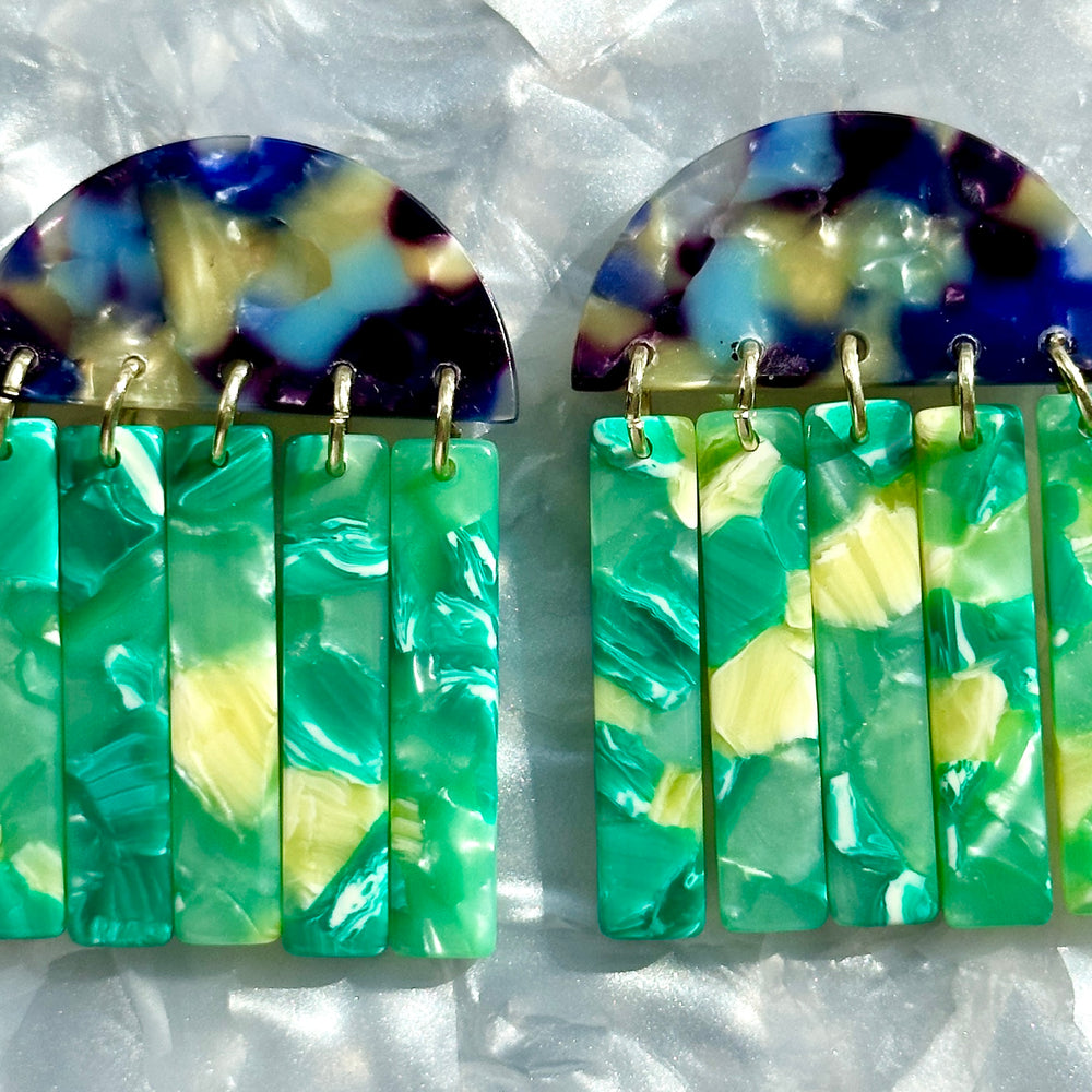 close up of acrylic Fringe Earrings in blue, lime green and yellow