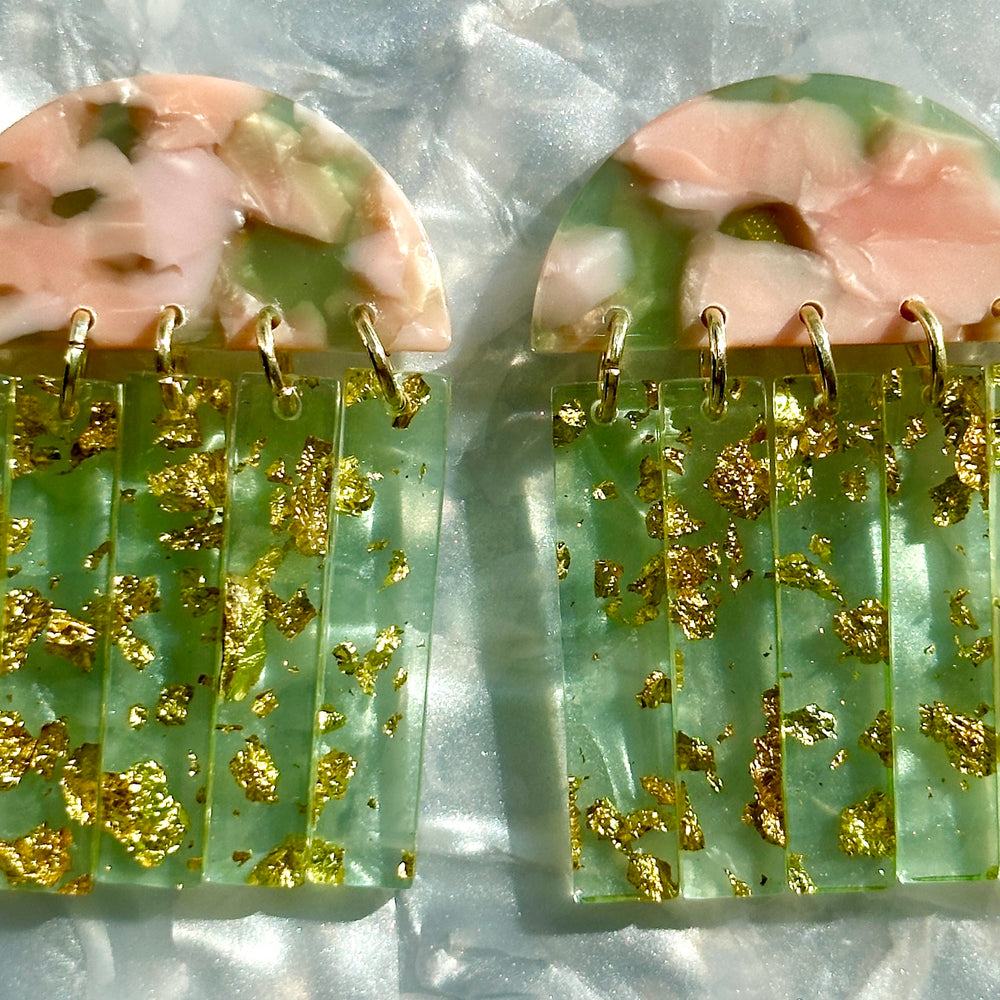 close up of acrylic Fringe Earrings in green and pink