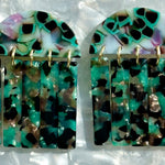 close up of acrylic Fringe Earrings in green, black and brown