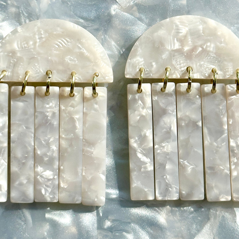 woman wearing close up of acrylic Fringe Earrings in white