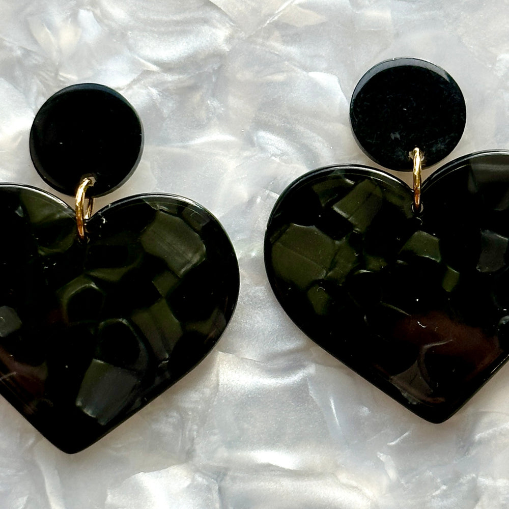 woman wearing acrylic Heart Earrings in Black