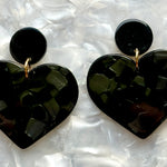 woman wearing acrylic Heart Earrings in Black