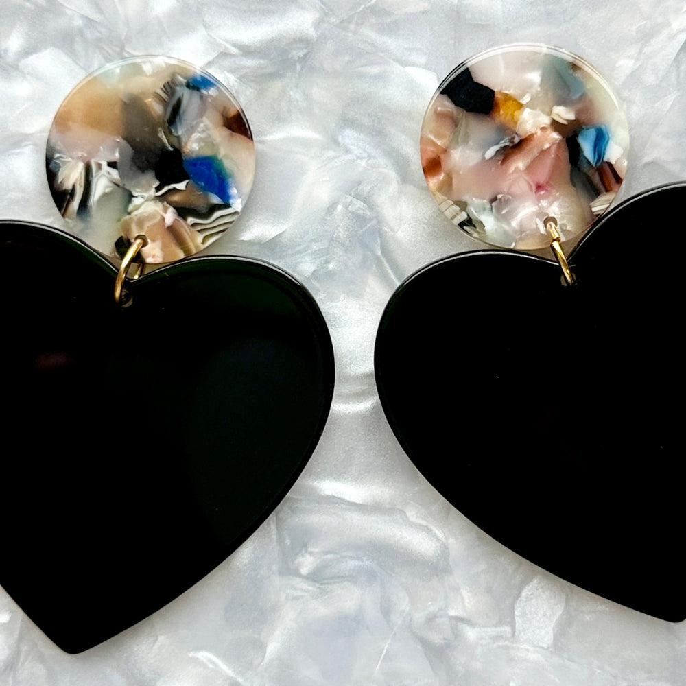 close up of acrylic Heart Earrings in Secret Admirer, black and light multicolor 