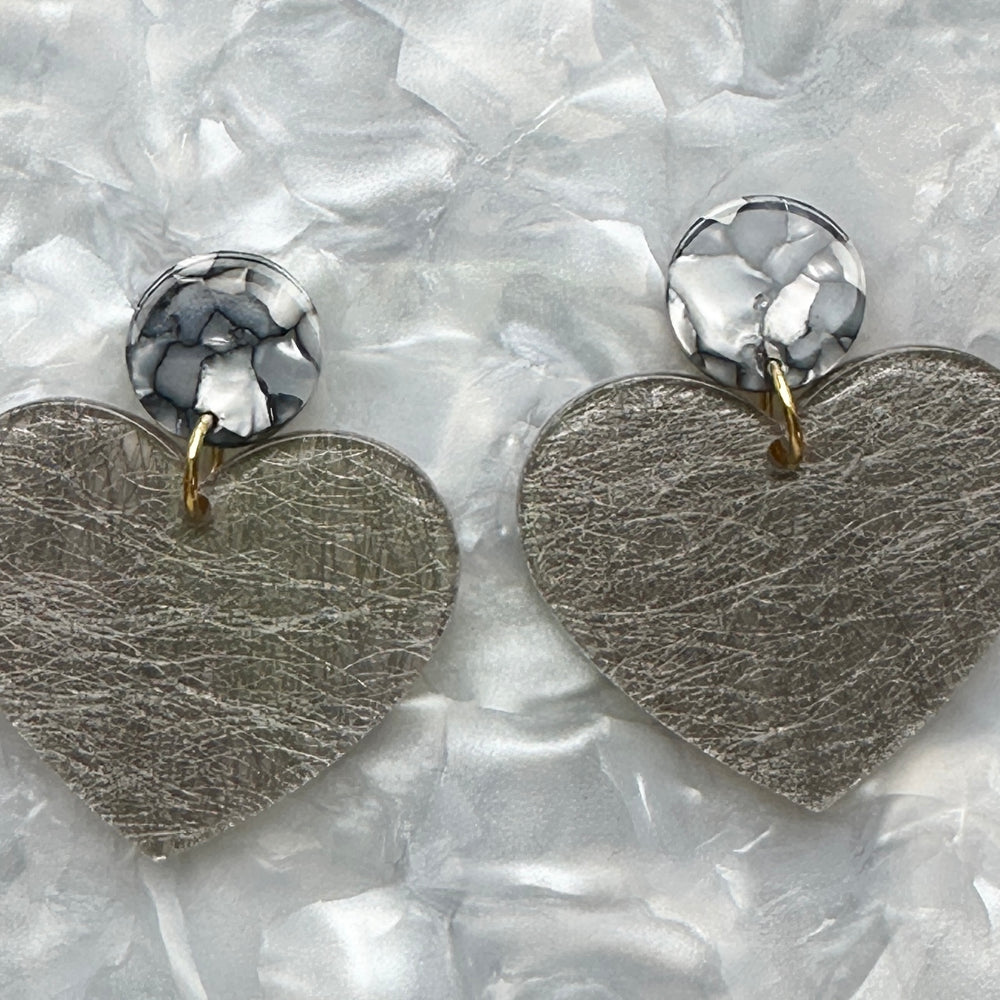 close up of acrylic Heart Earrings in Steel In Love and gray 