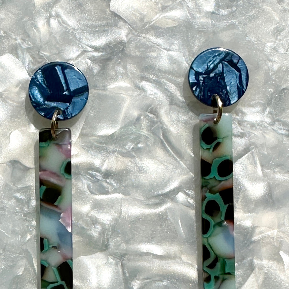 close up of acrylic Matchstick Drop Earrings in Lily Pond blue, green, pink