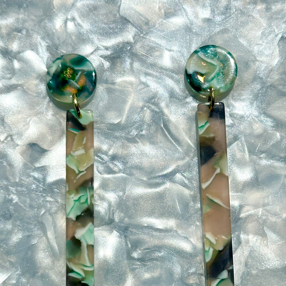 close up of acrylic Matchstick Drop Earrings in Mint To Be mint green and charcoal gray