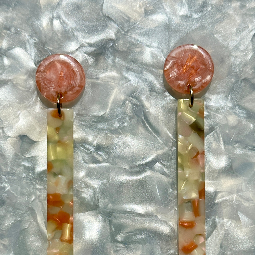 woman wearing acrylic Matchstick Drop Earrings in Peach and Cream