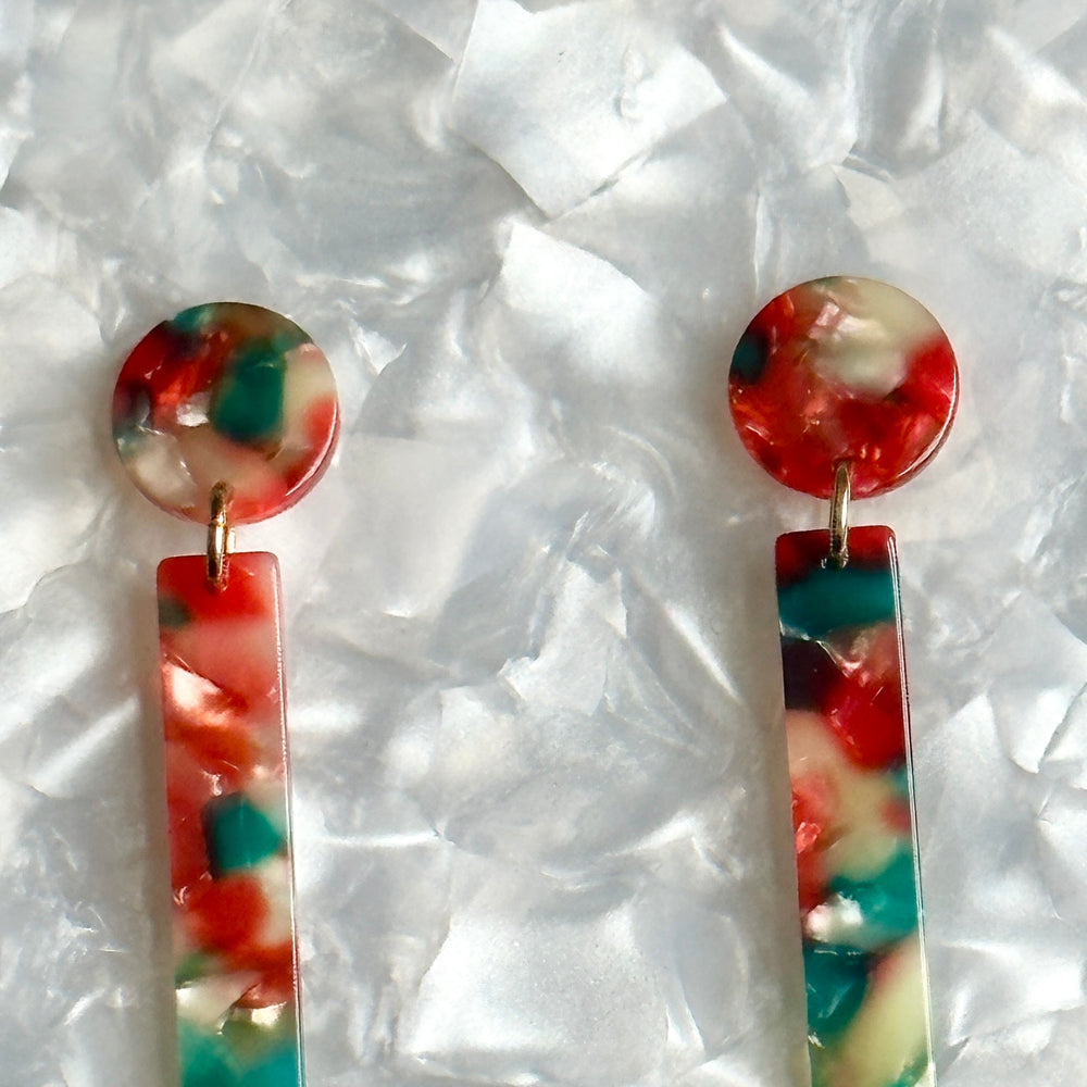 woman wearing acrylic Matchstick Drop Earrings in Red Hot Chili Pepper red, green and white