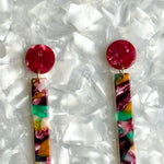 close up of acrylic Matchstick Drop Earrings in Swoon In The Lagoon magenta, green, yellow and white