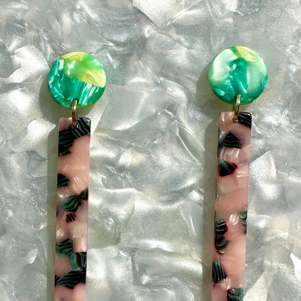 close up of acrylic Matchstick Drop Earrings in Tickled Pink with Envy pink, green and black