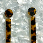 woman wearing acrylic Matchstick Drop Earrings in Tortoise