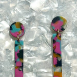 close up of acrylic Matchstick Drop Earrings in Tropical Punch yellow, blue and pink