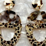 close up of acrylic Open Tab Drop Earrings in brown and beige