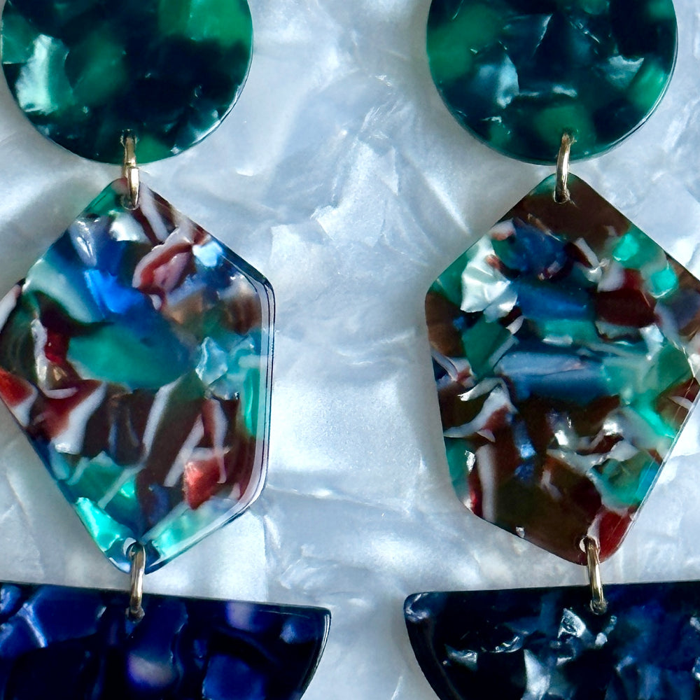 woman wearing acrylic Pendulum Drop Earrings in Force Of Nature, dark green, red, blue and green 