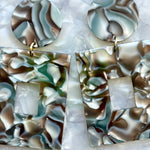 woman wearing acrylic Square Drop Earrings in Abalone, blue and gray 