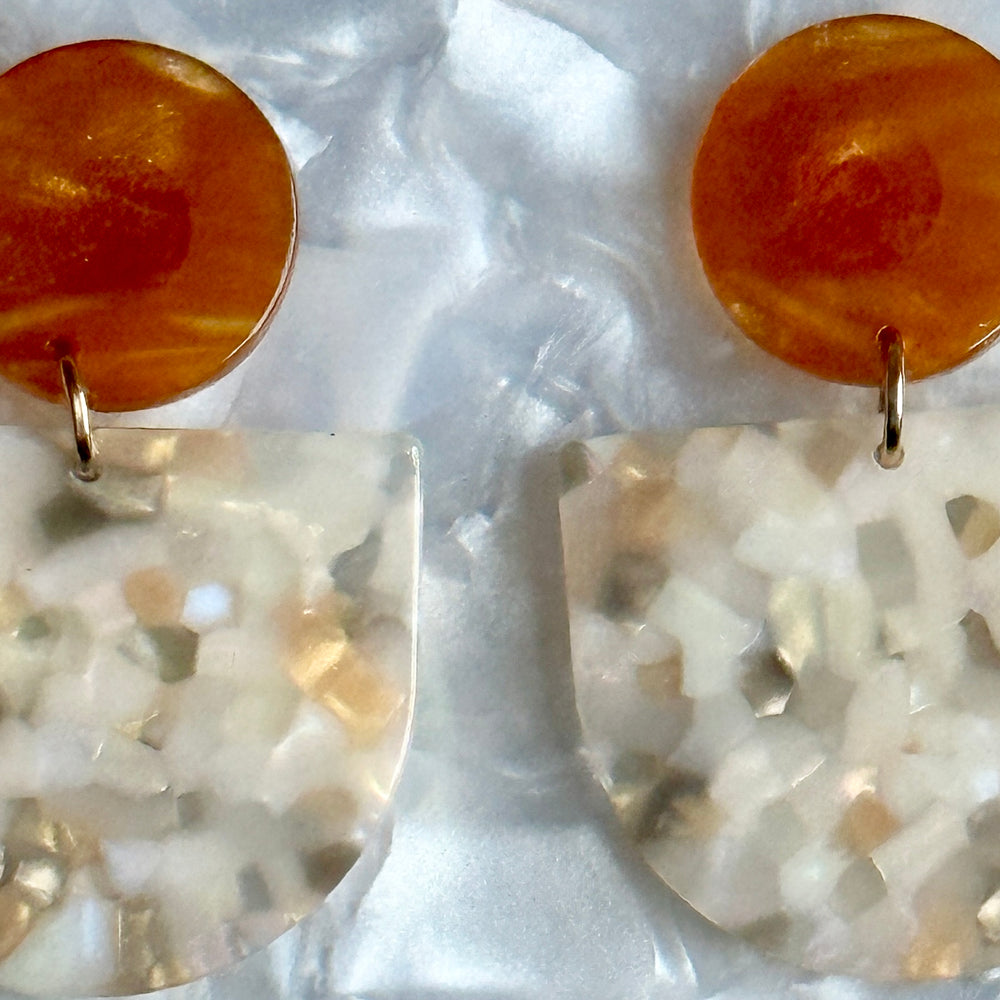 close up of acrylic Tab Drop Earrings in Peach, caramel and Cream