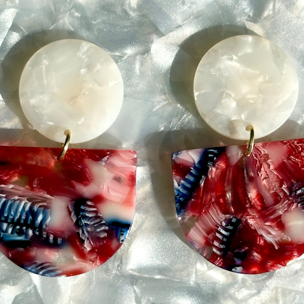 close up of acrylic Tab Drop Earrings in red, white and blue