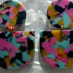 close up of acrylic Tab Drop Earrings in yellow, pink and blue