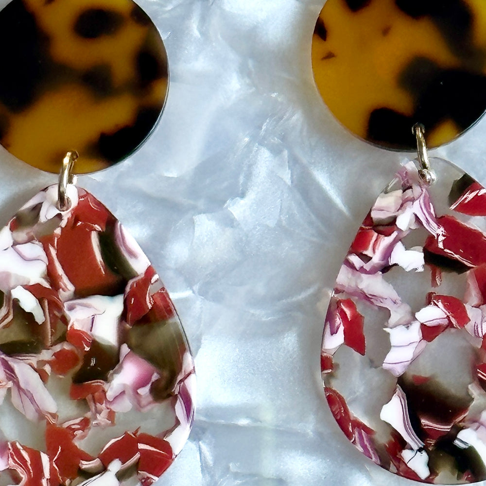 close up of acrylic Teardrop Earrings in Left Your Texts on Red, white and tortoise 