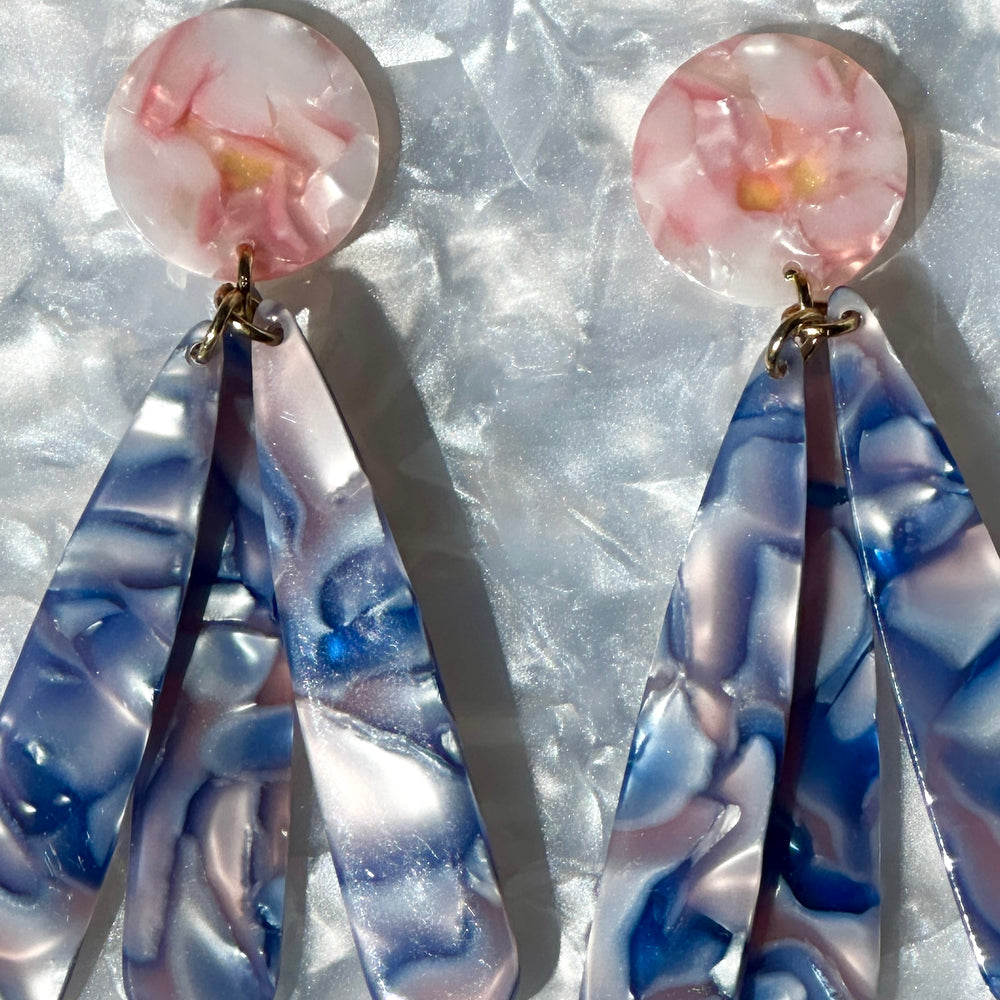 close up of acrylic flower Petal Drop Earrings in blue and pink