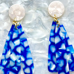 close up of acrylic flower Petal Drop Earrings in blue and white